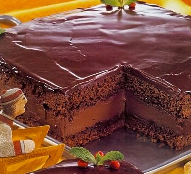  Dense layers of moist chocolate cake are sandwiched between an indulgent chocolate-rum cream and a luscious mocha frosting.